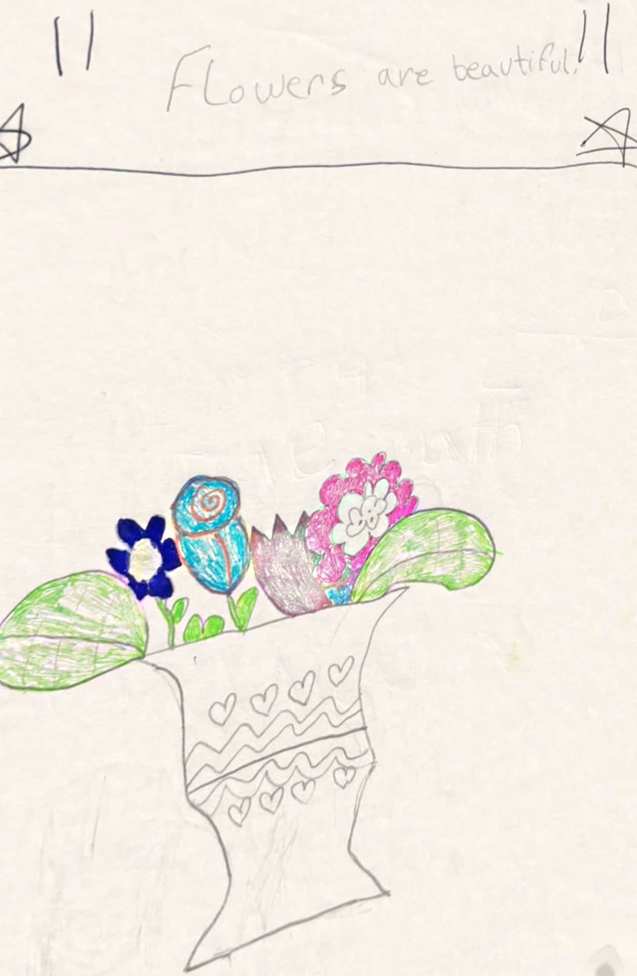 A childhood drawing of flowers, captioned flowers are beautiful