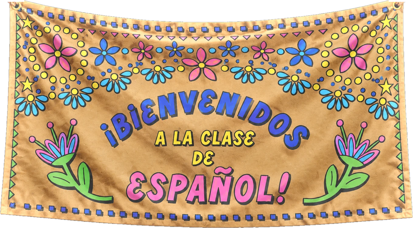 A hand-painted kraft banner reading Bienvenidos a la clase de Espanol, hanging from a rope